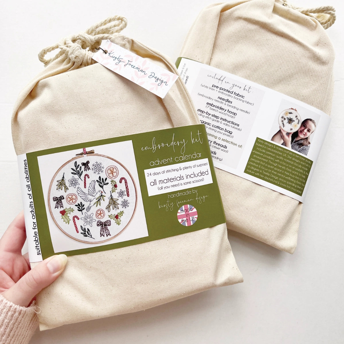 Front of Advent Calendar Embroidery Kit packaging – cotton bag with colourful printed band showing completed festive design.