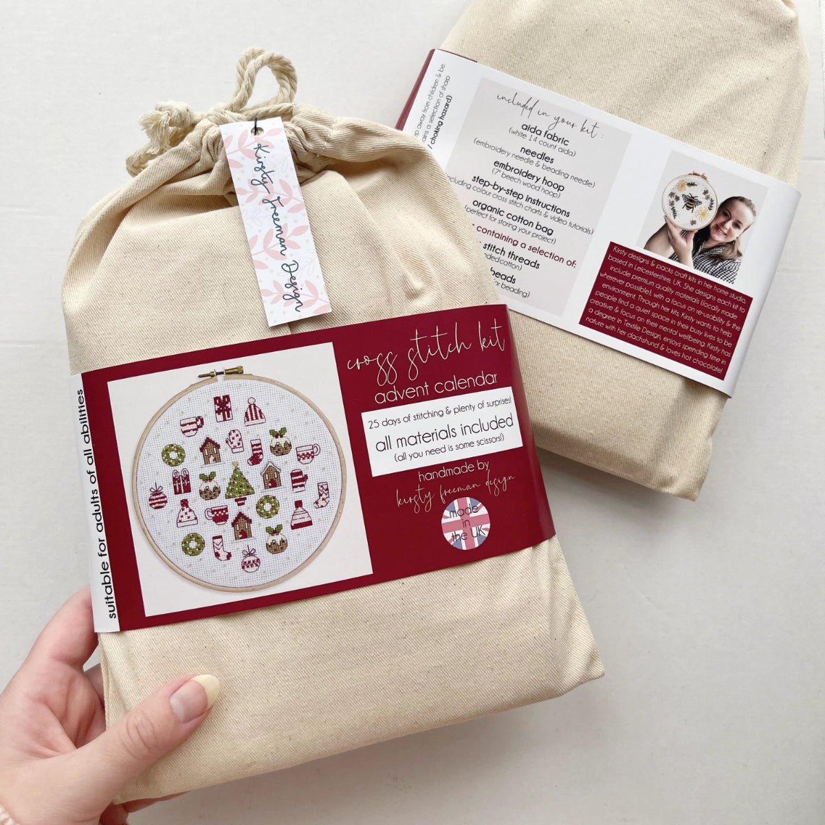 Front of Advent Calendar Cross Stitch Kit packaging – cotton bag with colourful printed band showing the finished project.