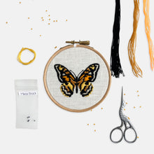 Load image into Gallery viewer, Butterfly Embroidery Kit - Kirsty Freeman Design. The completed embroidery of a butterfly, stitched in black, yellow and orange, on a white linen fabric.
