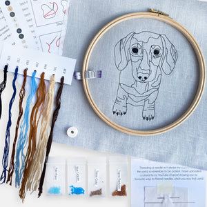 Sausage Dog Embroidery Kit - Kirsty Freeman Design. Contents of the kit include linen fabric, embroidery hoop, threads, beads, needles and instructions - making a perfect creative gift for adults.