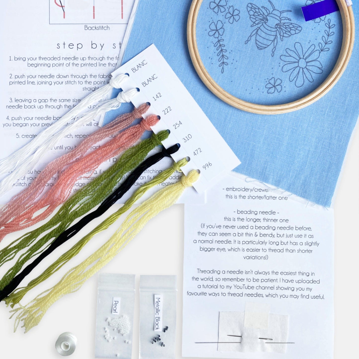 Floral Bee Embroidery Kit - Kirsty Freeman Design. This image shows all of the materials included in the embroidery kit.