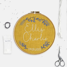 Load image into Gallery viewer, Baby Embroidery Kit - Kirsty Freeman Design. A mustard yellow personalised embroidery kit design, with the name of a new baby stitched across the centre of the hoop in white DMC stranded cotton.
