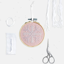 Load image into Gallery viewer, Snowflake Embroidery Kit - Kirsty Freeman Design. An embroidered Christmas decoration, stitched onto pink linen fabric, created using backstitch.
