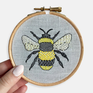 Bee Embroidery Kit Designed and Made in the UK - Kirsty Freeman Design. Completed embroidery kit: bee embroidery hoop, hand stitched in the UK onto blue linen.