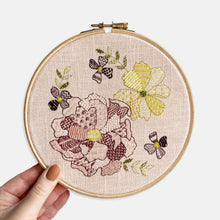 Load image into Gallery viewer, Flower Embroidery Kit - Kirsty Freeman Design. Our handmade embroidery kit shown when the project is finished. A selection of flowers and leaves have been stitched in shades of pink, purple, yellow and green, using a range of patterned stitches and seed beads.
